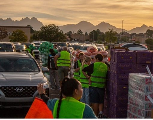 Efrain Trigueras, Roadrunner Foodbank’s vice president of operations for Southern New Mexico and Mexico gives a speech to new volunteers at a Hunger Action Month food distribution event at the Mesilla Valley Mall parking lot, in Las Cruces, Saturday, Sept. 19, 2026. / Isabel Laulhé